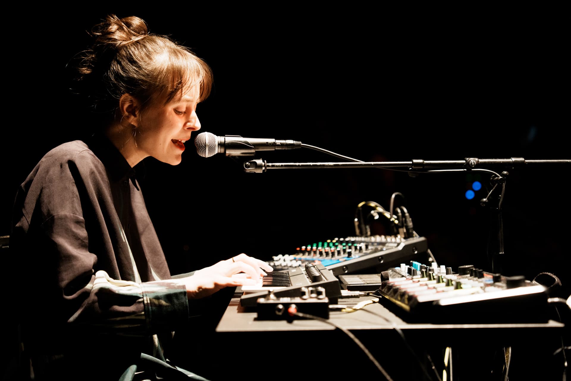 A woman performs on stage.